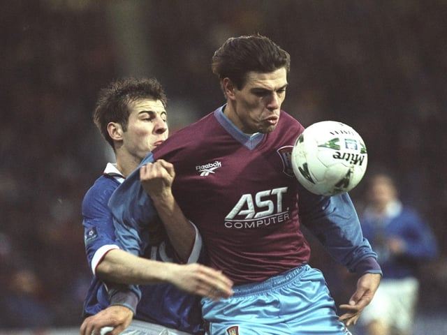 Dave Waterman tangles with Aston Villa's Savo Milosevic in an FA Cup Third Round replay at Villa Park as the Blues slip to a 1-0 defeat. Picture: Julian Herbert/Allsport