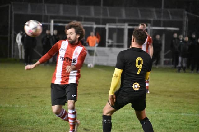 Colden Common's Terry New, left, gets to the ball ahead of Callum Parker. Picture: Paul Proctor.