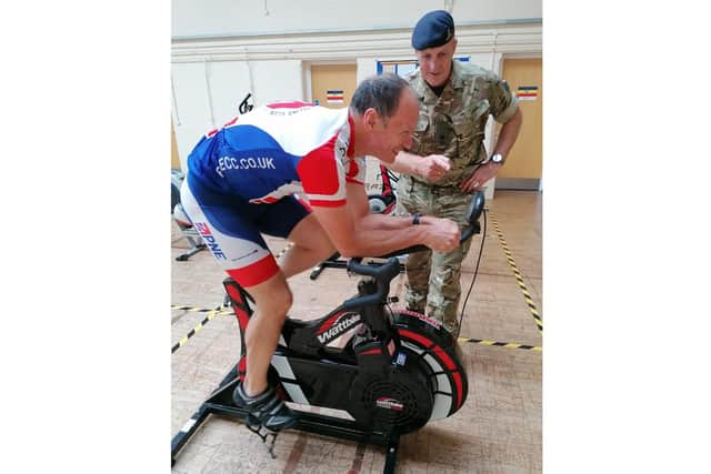 Lance Bombardier Kevin Rimington, pictured on a bike with Major Colin McQuillan, commander of 295 Battery, Royal Artillery behind him. Photo: MoD