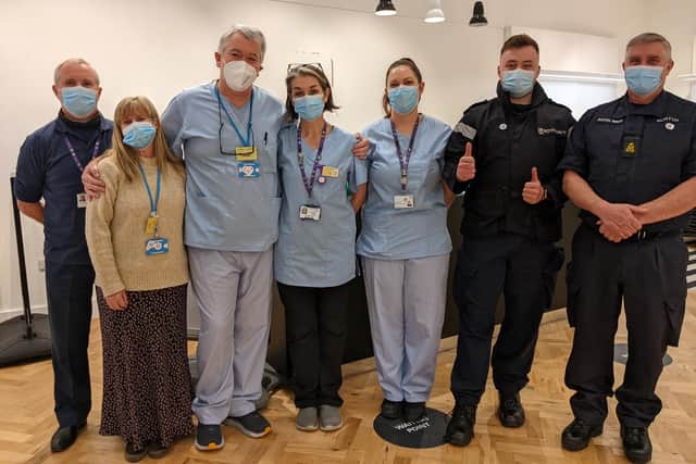 The vaccine pop-up clinic team at Gunwharf Quays today: Alan Dobson, Claire Lancashire, Noel Lilly, Jo Cokes, Katie Curtis, Callum BL, and Rod Morton. Picture: Emily Turner