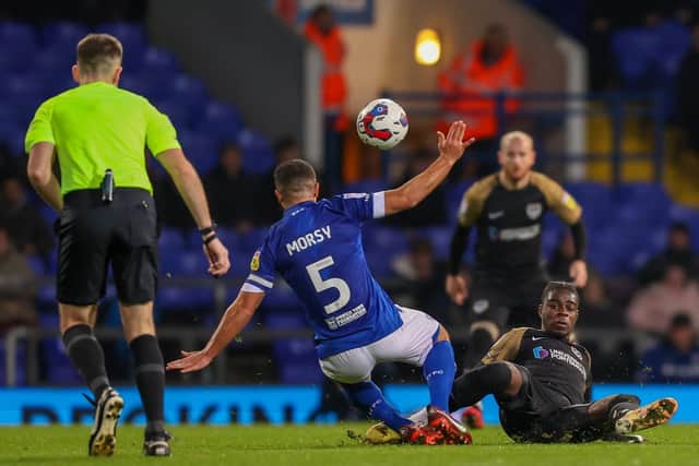 Jay Mingi challenges Ipswich skipper Sam Morsy in the Papa John's Trophy. Picture: Simon Davies/ProSportsImages