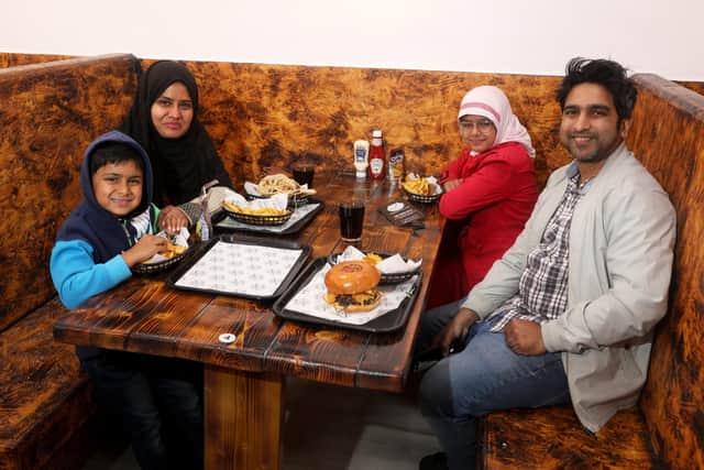 Restaurant offering the UK's first Wagyu donner kebab opens in Portsmouth. Started and owned by two Southsea brothers, Ashraf Ali and Yousuf Ali. Pictured is Habibur Rahman and his family. Picture: Sam Stephenson.