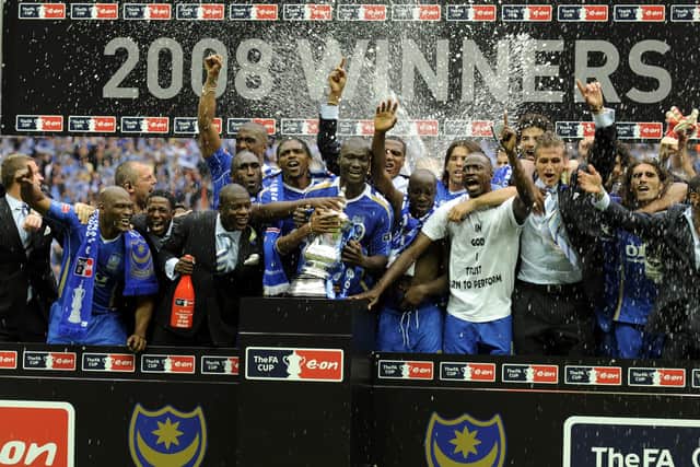 Papa Bouba Diop was at the forefront of Pompey's FA Cup celebrations in 2008 - minutes later he gave his shirt away to Colin Clement. Picture: Steve