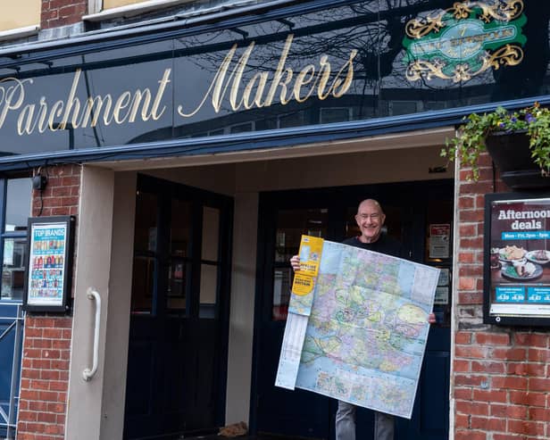Steve Jones who has visited 460 Wetherspoons and plans to go to all of them during his retirement,  pictured outside The Parchment Makers Pub in Havant with his Map of the UK that he records his visits on. 

Picture by Emma Terracciano.