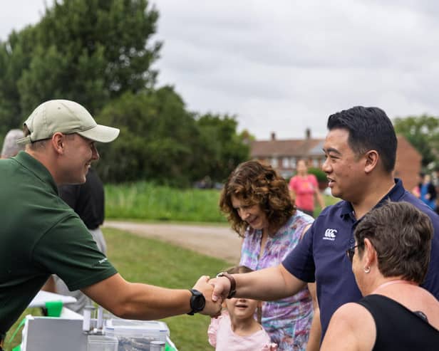 Alan Mak MP talks to one of the stallholders at the Summer Fun Day