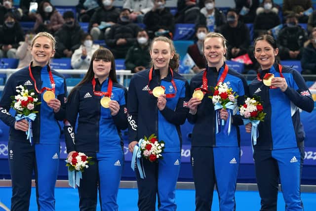 Great Britain's Mili Smith, Hailey Duff, Jennifer Dodds, Vicky Wright and Eve Muirhead celebrate with the gold medal after victory in the Women's Gold Medal Game against Japan during day sixteen of the Beijing 2022 Winter Olympic Games at the National Aquatics Centre in China.