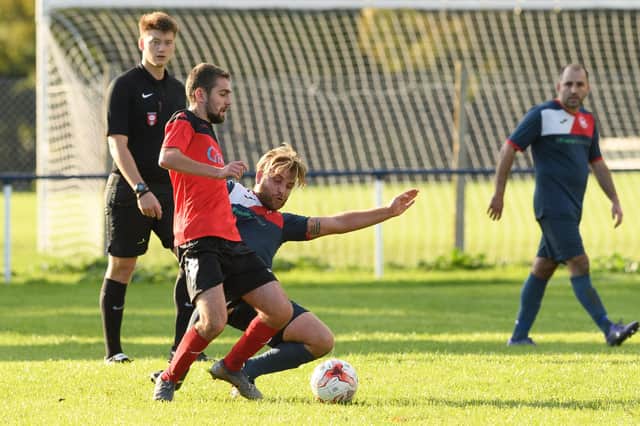 Billy Butcher makes a tackle during last season's Paulsgrove v Bush Hill fixture which the visitors won 3-1 at Marsden Road. Picture: Keith Woodland