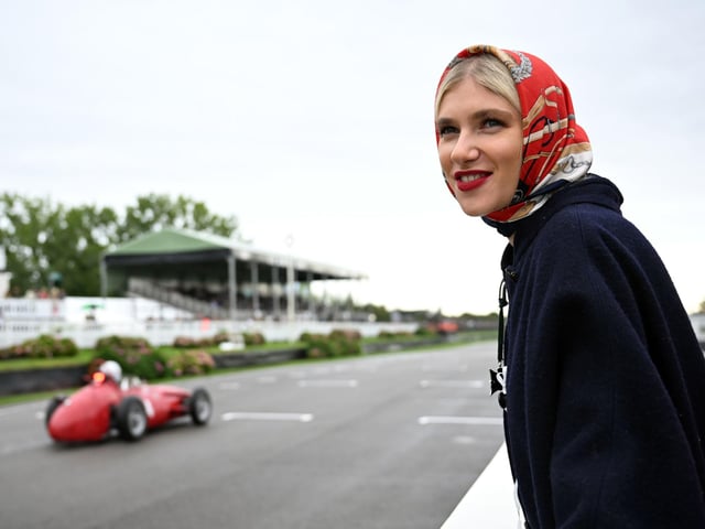 A racegoer watches the action at Goodwood Revival in West Sussex. Photo: John Nguyen/PA Wire