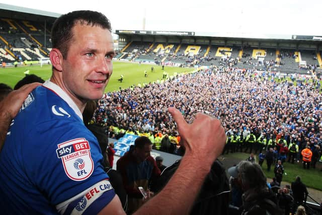 Michael Doyle celebrates Pompey's League Two promotion at Notts County. Picture: Joe Pepler