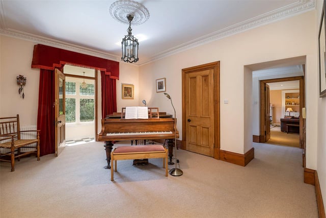 The large hallway has room for a piano.