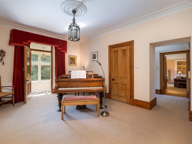 The large hallway has room for a piano.