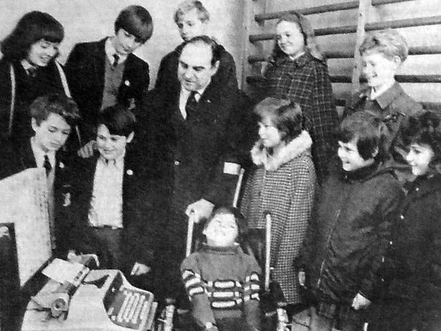 Members of the Chipper Club who went to the Cerebral Palsy Day Unit at Queen Alexandra Hospital, Cosham, to see the handing over of the Possum electric typewriter they had helped raise money for, pictured with Uncle Mike and 10-year-old Lee Webber who demonstrated how he uses the machine to write with his feet