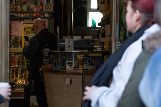 A group of people queuing outside Pie and Vinyl
