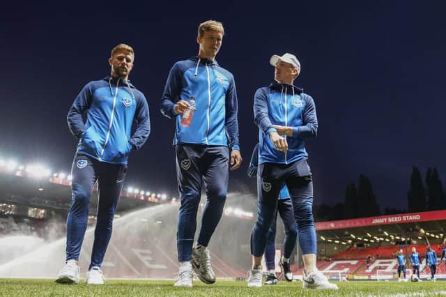 Portsmouth players inspect the pitch at The Valley Stadium during the EFL Sky Bet League 1 match between Charlton Athletic and Portsmouth at The Valley, London, England on 17 October 2022.