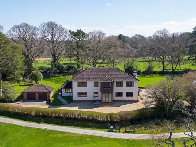 This home is positioned on private grounds and it has four bedrooms, three bathrooms and three reception rooms.