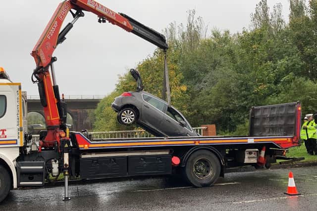 Car is fished out of the water at Delme Roundabout in Fareham after crash. Picture: Kimberley Barber