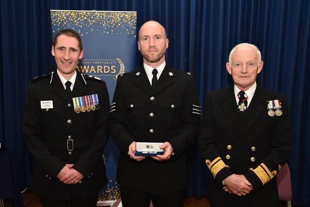 Acting Chief Constable Ben Snuggs, Sgt David Fuge of the roads policing unit who has been decorated for 22 years' service, and Vice Lord-Lieutenant, Rear Admiral Iain Henderson Picture: Hampshire police Picture: Jan Brayley/Hampshire police