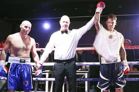 Joel McIntyre, right, has his hand raised after defeating Nikita Basin on his ring return last October. Picture: Barry Zee