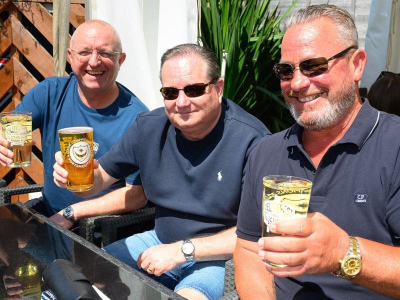 Jock Watson, Matt Stacey and Bradley Whitaker enjoy a beer in the sunshine.Picture: Keith Woodland (250521-5)