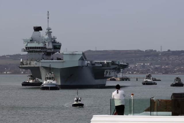 HMS Queen Elizabeth sails from Portsmouth.
