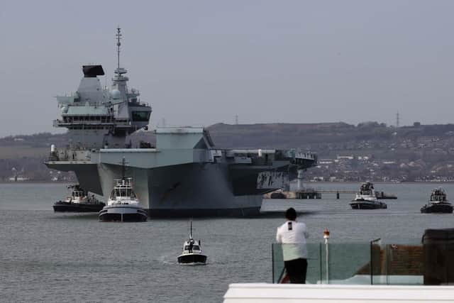 HMS Queen Elizabeth sails from Portsmouth.