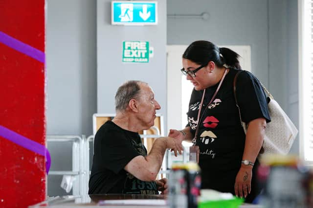 Glen Tyler says cheerio to support worker Nicola Simmons. Pathways Support for adults with learning disabilities has reopened at Fratton Community Centre
Picture: Chris Moorhouse (jpns 290721-32)