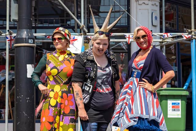 Decades from the Queen's reign on display at the Stoke Road Community Festival - the 1960s by Lesley Meenaghan, 55, the 1970s by Lauren Jo, 34, and the 1950s by Caroline Dinenage MP, 50 Picture: Mike Cooter (040622)