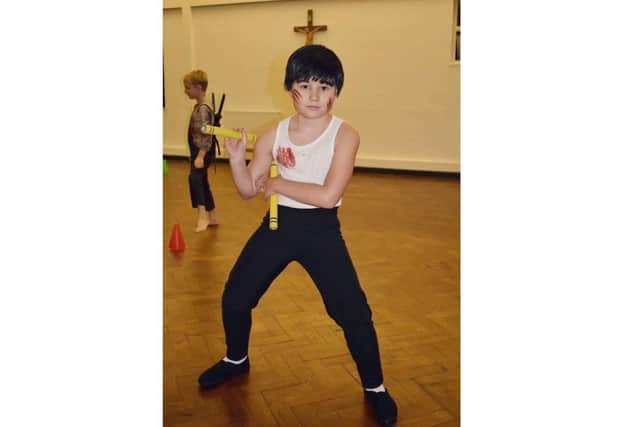 Max Porter as Bruce Lee