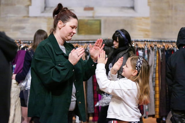 Sarah Woolley and her daughter, Lily, 7, play pattercake in a break from the shopping. Picture: Chris Moorhouse (010225-42)