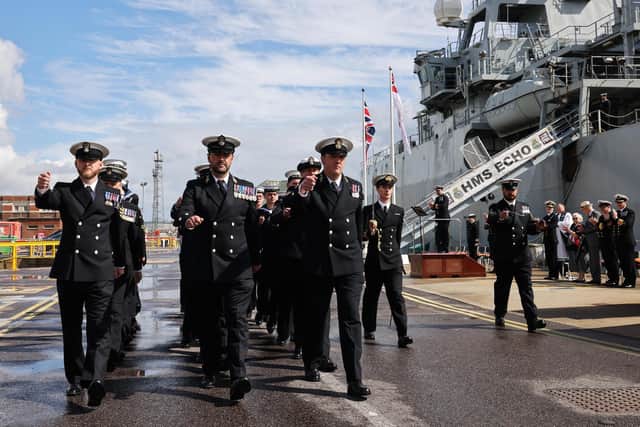 The ship's company of HMS Echo march off during her decommissioning ceremony held in HMNB Portsmouth