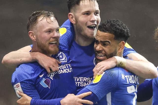 George Hirst celebrates his Oxford United goal with Aiden O'Brien Louis Thompson.