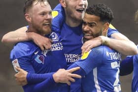 George Hirst celebrates his Oxford United goal with Aiden O'Brien Louis Thompson.