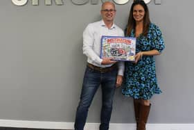 Entrepreneur Rachel Lowe reveals the 20th anniversary of Destination Portsmouth board game is coming later this year. She is pictured with Clive Hutchings, STR Group’s executive director and founder, who has already stepped forward as a sponsor of the new game. Rachel is looking for other businesses to come on board. Picture courtesy of Rachel Lowe.