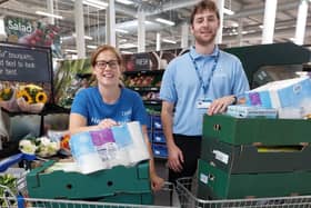 Fratton Park community champion Gemma Morrison hands over essentials to a Portsmouth City Council representative.