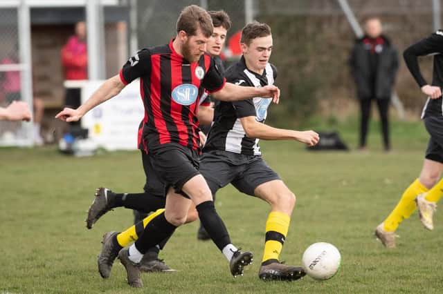 Laurence Wall (red/black) netted Locks Heath's third goal in their entertaining 3-3 draw with Paulsgrove. Picture: Keith Woodland