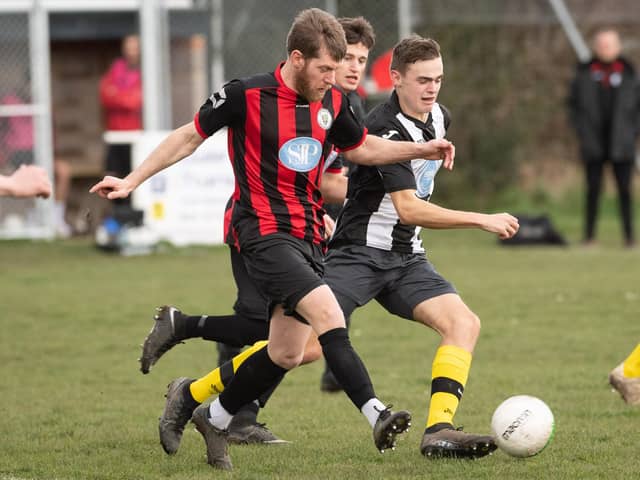 Laurence Wall (red/black) netted Locks Heath's third goal in their entertaining 3-3 draw with Paulsgrove. Picture: Keith Woodland