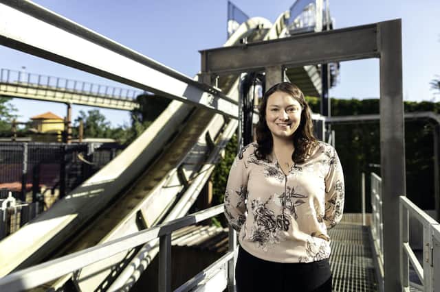 Michelle Hicks in front of a rollercoaster. Picture: Harry Parvin