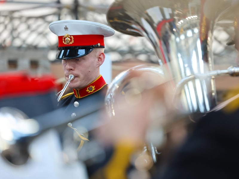 Pictured: The Royal Marines Band perform during the HMS Victory ceremony.