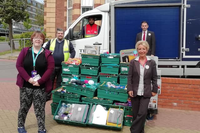 Tesco's staff deliver £2,400 worth of goods to Queen Alexandra Hospital. Glenda Soper (front left) alongside QA employee, Natalie Waight, and Steve Taylor (behind Natalie)