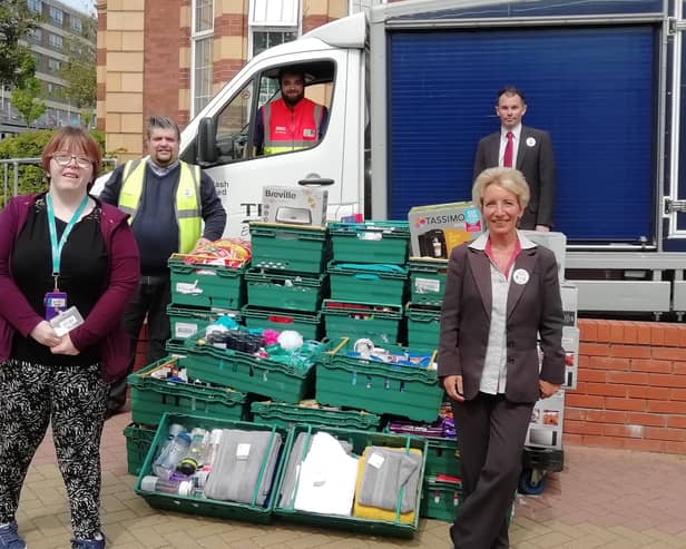 Tesco's staff deliver £2,400 worth of goods to Queen Alexandra Hospital. Glenda Soper (front left) alongside QA employee, Natalie Waight, and Steve Taylor (behind Natalie)
