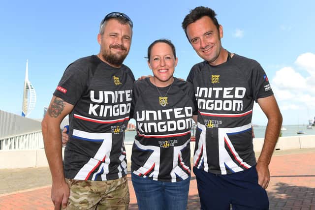 Jay Saunders, pictured right with Squadron Leader Sherry McBain - who he helped prepare for the Invictus games, and former soldier John Shepherd, left.