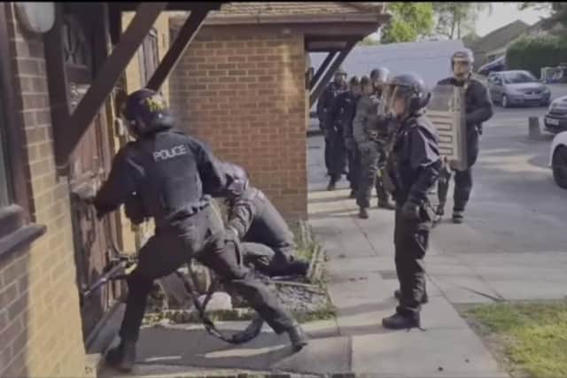 Police smash their way into a home in Botley during a drugs raid Picture: Hampshire police