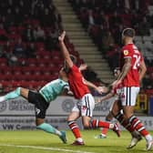 Pompey forward Dane Scarlett has his shirt pulled back by Charlton defender Eoghan O'Connell in the penalty box during the Blues' 3-0 defeat at the Valley.