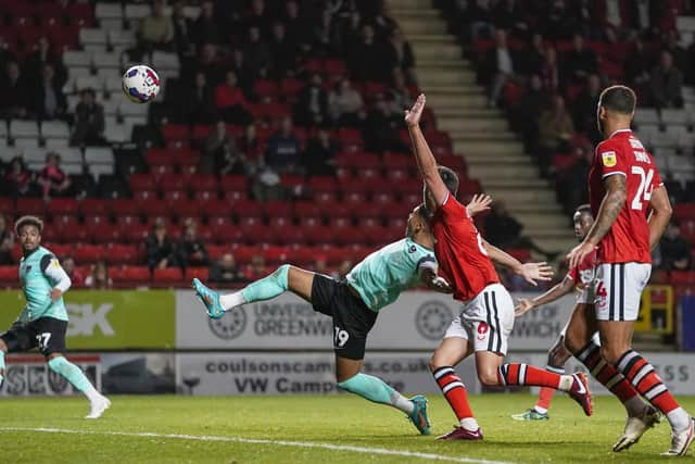 Pompey forward Dane Scarlett has his shirt pulled back by Charlton defender Eoghan O'Connell in the penalty box during the Blues' 3-0 defeat at the Valley.