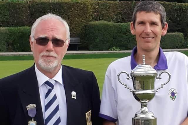 Dave Brookes, right, receives his Champion of Champion silverware from P&D Competition Secretary Simon Batcheler