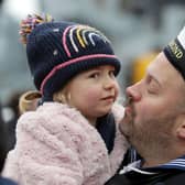 A sailor from HMS Richmond pictured embracing his little girl after he returned home from a seven-month deployment 
Photo: LPhot Juliet Ritsma