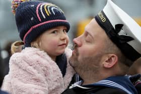 A sailor from HMS Richmond pictured embracing his little girl after he returned home from a seven-month deployment 
Photo: LPhot Juliet Ritsma