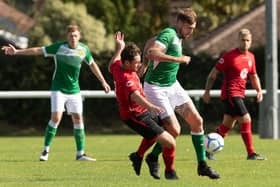 Stanlie Hopkins (second right, green shirt) has returned to action for Moneyfields - less than three months after being violently assaulted in a Cosham pub car park. Picture: Keith Woodland