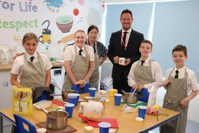 Stephen Morgan with The Bridge students in their skills for life room