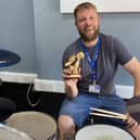 Departing St Vincent College music teacher Chris Harris with the mayor’s award he won in 2022
